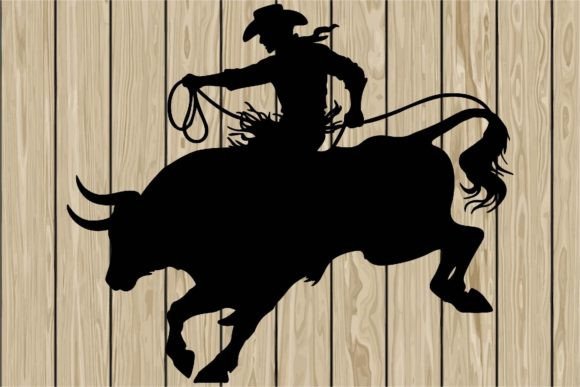 Cowboy Riding a Bull in Wild Silhouette